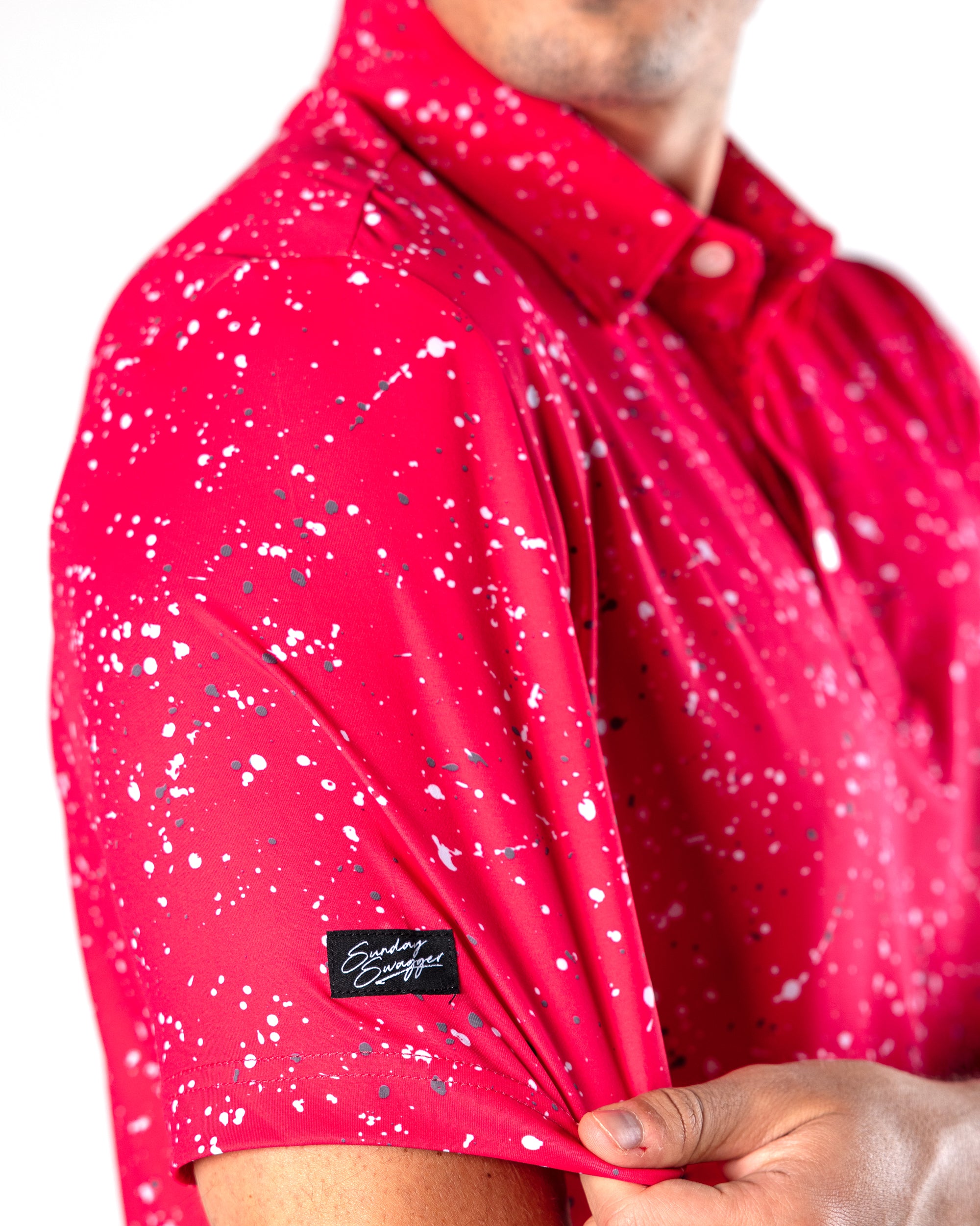 Red mens golf shirt with black and white splatter pattern | Sunday Swagger