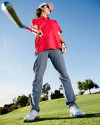 Man golfing wearing Gnarly golf polo by Sunday Swagger