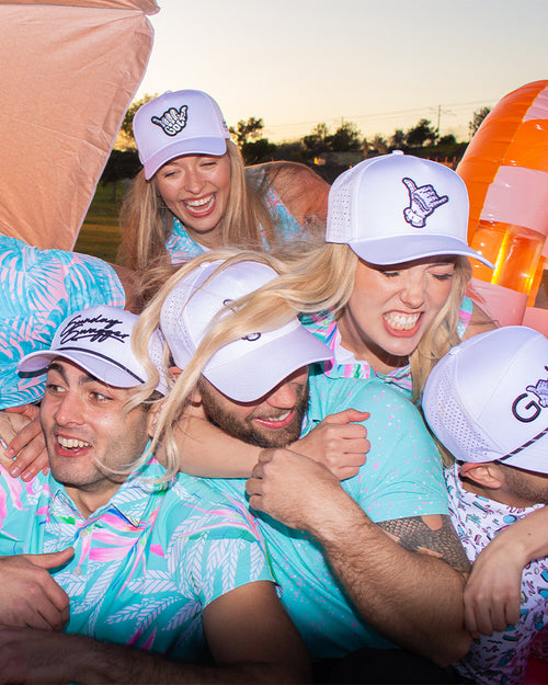 Sunday Swagger signature golf glove shaka hats are a staple on the golf course or as your every-day hat. Pictured is our white logo and shaka hats on some goofy people having fun on the golf course for spring break.